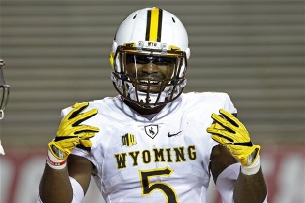 Wyoming running back Brian Hill reacts to spectators while warming up before the start of an NCAA college football game against New Mexico in Albuquerque, N.M., Saturday, Nov. 26, 2016. (AP Photo/Andres Leighton)