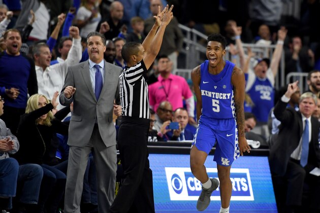 LAS VEGAS, NV - DECEMBER 17:  Head coach John Calipari of the Kentucky Wildcats looks on as Malik Monk #5 celebrates after hitting a go-ahead 3-pointer late in the team's 103-100 win over the North Carolina Tar Heels during the CBS Sports Classic at T-Mobile Arena on December 17, 2016 in Las Vegas, Nevada.  (Photo by Ethan Miller/Getty Images)