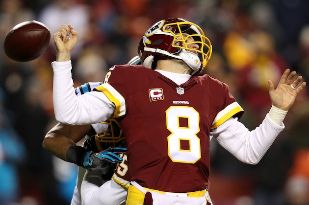 LANDOVER, MD - DECEMBER 19: Quarterback Kirk Cousins #8 of the Washington Redskins fumbles the ball in the third quarter against the Carolina Panthers at FedExField on December 19, 2016 in Landover, Maryland. (Photo by Patrick Smith/Getty Images)