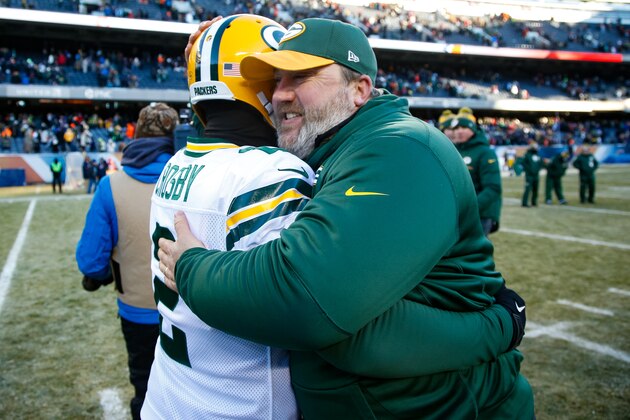 CHICAGO, IL - DECEMBER 18:  Kicker Mason Crosby #2 of the Green Bay Packers hugs quarterbacks coach Alex Van Pelt after winning the game at Soldier Field on December 18, 2016 in Chicago, Illinois. The Green Bay Packers defeated the Chicago Bears 30-27.  (Photo by Joe Robbins/Getty Images)