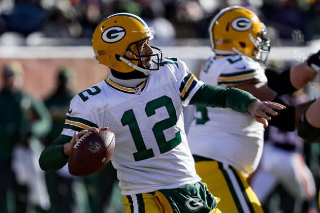 CHICAGO, IL - DECEMBER 18:   Quarterback Aaron Rodgers #12 of the Green Bay Packers looks to pass in the first quarter against the Chicago Bears at Soldier Field on December 18, 2016 in Chicago, Illinois.  (Photo by Jonathan Daniel/Getty Images)