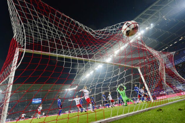 Schalke's Sead Kolasinac scores an own goal during the German first division Bundesliga soccer match between RB Leipzig and FC Schalke 04 in Leipzig, Germany, Saturday, Dec. 3, 2016. (AP Photo/Jens Meyer)