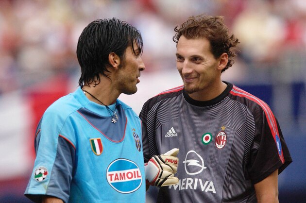 EAST RUTHERFORD, NJ - AUGUST 3:   Juventus goalkeeper Gianluigi Buffon #1 and AC Milan goalkeeper Val Fiorio #1 exchange a few words of encouragement prior to the penalty kick shootout after a 1-1 tie in the Supercoppa match between Juventus and AC Milan on August 3, 2003 at Giants Stadium in East Rutherford, New Jersey.  Juventus won the match following a 1-1 tie and penalty shootout.   (Photo by M. David Leeds/Getty Images)
