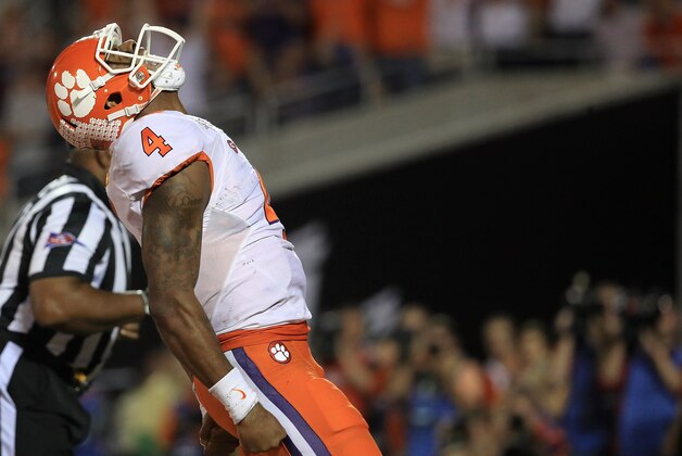 ORLANDO, FL - DECEMBER 03:  Deshaun Watson #4 of the Clemson Tigers celebrates a touchdown the ACC Championship against the Virginia Tech Hokies on December 3, 2016 in Orlando, Florida.  (Photo by Mike Ehrmann/Getty Images)