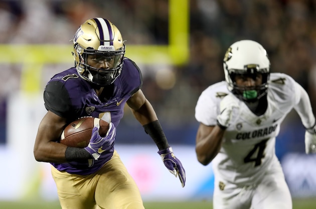 SANTA CLARA, CA - DECEMBER 02:  John Ross #1 of the Washington Huskies gets past Chidobe Awuzie #4 of the Colorado Buffaloes on his way to scoring a touchdown during the Pac-12 Championship game at Levi's Stadium on December 2, 2016 in Santa Clara, California.  (Photo by Robert Reiners/Getty Images)