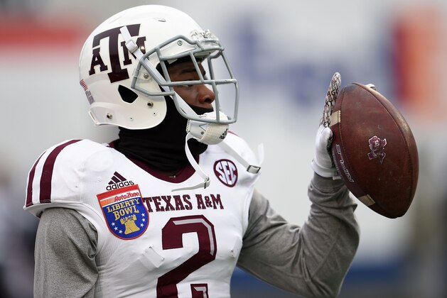 MEMPHIS, TN - DECEMBER 29:  Speedy Noil #2 of the Texas A&M Aggies participates in warmups prior to the 56th annual Autozone Liberty Bowl against the West Virginia Mountaineers at Liberty Bowl Memorial Stadium on December 29, 2014 in Memphis, Tennessee.  Texas A&M won the game 45-37.  (Photo by Stacy Revere/Getty Images)
