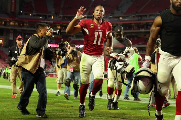 GLENDALE, AZ - DECEMBER 18:  Wide receiver Larry Fitzgerald #11 of the Arizona Cardinals waves to fans as he runs off the field folowing the NFL game against the New Orleans Saints at the University of Phoenix Stadium on December 18, 2016 in Glendale, Arizona. The Saints defeated the Cardinals 48-41.  (Photo by Christian Petersen/Getty Images)