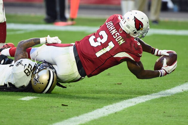 GLENDALE, AZ - DECEMBER 18:  Running back David Johnson #31 of the Arizona Cardinals scores a seven yard touchdown against cornerback B.W. Webb #28 of the New Orleans Saints in the fourth quarter of the NFL game at University of Phoenix Stadium on December 18, 2016 in Glendale, Arizona.  (Photo by Norm Hall/Getty Images)