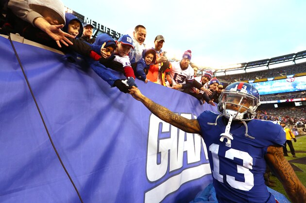 EAST RUTHERFORD, NJ - DECEMBER 18:   Odell Beckham #13 of the New York Giants greets the fan after their 17-6 win against the Detroit Lions during their game at MetLife Stadium on December 18, 2016 in East Rutherford, New Jersey.  (Photo by Al Bello/Getty Images)