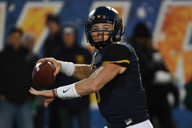 MORGANTOWN, WV - DECEMBER 03:  Skyler Howard #3 of the West Virginia Mountaineers drops back to pass in the first half during the game against the Baylor Bears at Mountaineer Field on December 3, 2016 in Morgantown, West Virginia. (Photo by Justin Berl/Getty Images)