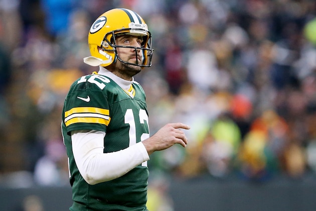 GREEN BAY, WI - DECEMBER 11:  Aaron Rodgers #12 of the Green Bay Packers walks across the field in the first quarter against the Seattle Seahawks at Lambeau Field on December 11, 2016 in Green Bay, Wisconsin. (Photo by Dylan Buell/Getty Images)
