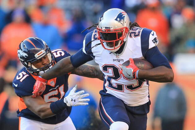 DENVER, CO - DECEMBER 18:  Running back LeGarrette Blount #29 of the New England Patriots rushes as inside linebacker Todd Davis #51 of the Denver Broncos attempts a tackle in the first quarter of a game at Sports Authority Field at Mile High on December 18, 2016 in Denver, Colorado. (Photo by Sean M. Haffey/Getty Images)