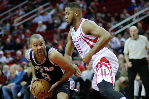 HOUSTON, TX - DECEMBER 20:  Tony Parker #9 of the San Antonio Spurs drives past Eric Gordon #10 of the Houston Rockets at Toyota Center on December 20, 2016 in Houston, Texas.NOTE TO USER: User expressly acknowledges and agrees that, by downloading and/or using this photograph, user is consenting to the terms and conditions of the Getty Images License Agreement.  (Photo by Bob Levey/Getty Images)