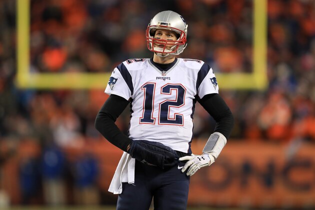 DENVER, CO - DECEMBER 18:  Quarterback Tom Brady #12 of the New England Patriots looks on in the fourth quarter of a game against the Denver Broncos at Sports Authority Field at Mile High on December 18, 2016 in Denver, Colorado. (Photo by Sean M. Haffey/Getty Images)