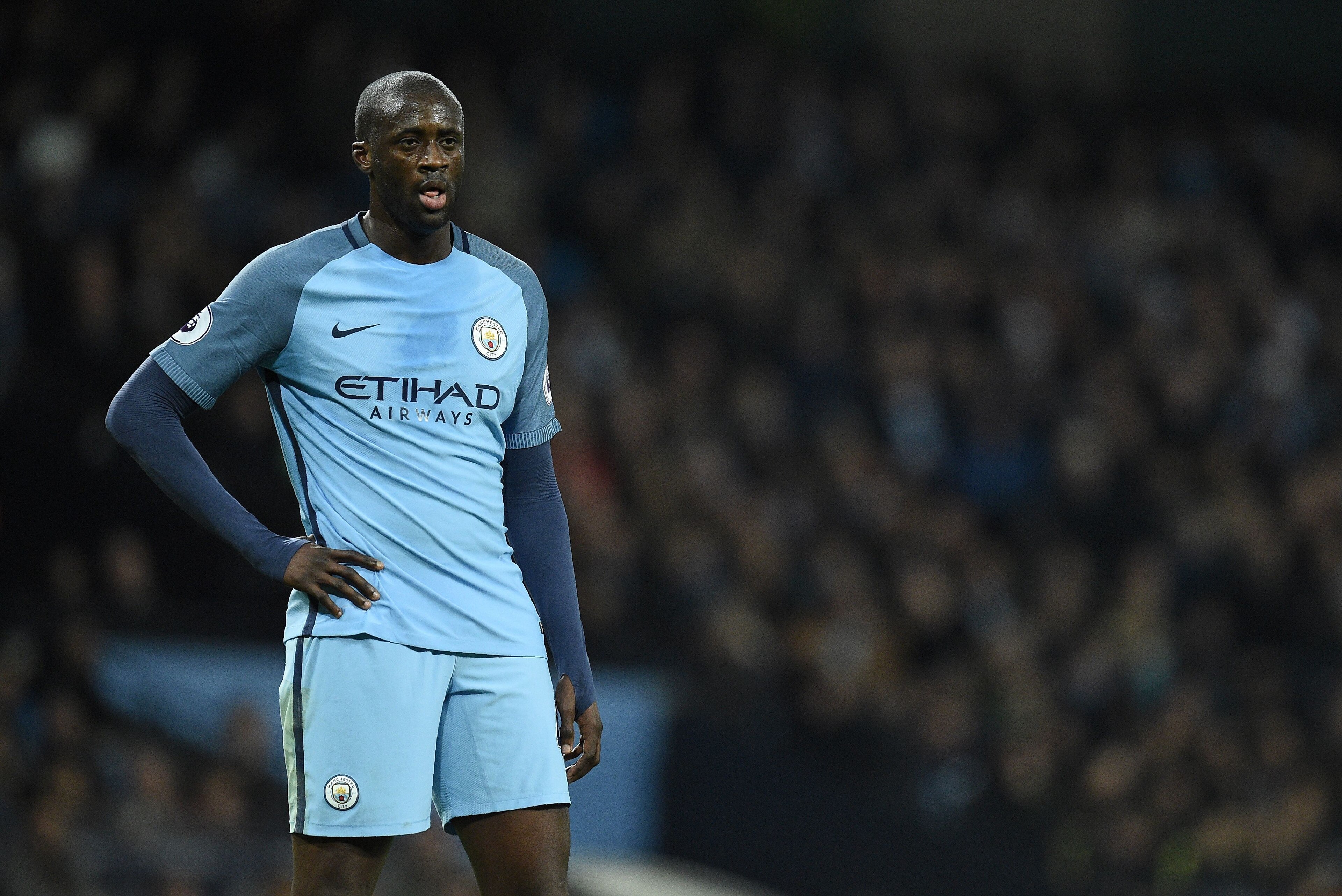 Manchester City's Ivorian midfielder Yaya Toure reacts during the English Premier League football match between Manchester City and Arsenal at the Etihad Stadium in Manchester, north west England, on December 18, 2016. / AFP / Oli SCARFF / RESTRICTED TO EDITORIAL USE. No use with unauthorized audio, video, data, fixture lists, club/league logos or 'live' services. Online in-match use limited to 75 images, no video emulation. No use in betting, games or single club/league/player publications. / (Photo credit should read OLI SCARFF/AFP/Getty Images) Manchester City's Ivorian midfielder Yaya Toure reacts during the English Premier League football match between Manchester City and Arsenal at the Etihad Stadium in Manchester, north west England, on December 18, 2016. / AFP / Oli SCARFF / RESTRICTED TO EDITORIAL USE. No use with unauthorized audio, video, data, fixture lists, club/league logos or 'live' services. Online in-match use limited to 75 images, no video emulation. No use in betting, games or single club/league/player publications. / (Photo credit should read OLI SCARFF/AFP/Getty Images)