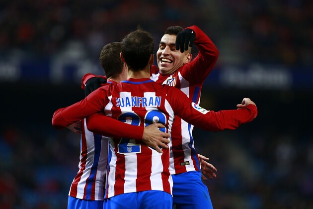 MADRID, SPAIN - DECEMBER 20: Juan Francisco Torres alias Juanfran (2ndL) of Atletico de Madrid celebrates scoring their third goal with teammates Angel Martin Correa (R) and Sime Vrsaljko (L)  during the Copa del Rey Round of 16 match between Club Atletico de Madrid and CD Guijuelo at Vicente Calderon stadium  on December 20, 2016 in Madrid, Spain. (Photo by Gonzalo Arroyo Moreno/Getty Images)