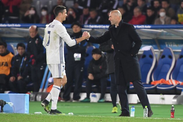 YOKOHAMA, JAPAN - DECEMBER 18:  Cristiano Ronaldo of Real Madrid greets Zinedine Zidane, Manager of Real Madrid after he is subtituted following an injury during the FIFA Club World Cup Final match between Real Madrid and Kashima Antlers at International Stadium Yokohama on December 18, 2016 in Yokohama, Japan.  (Photo by Masashi Hara/Getty Images)