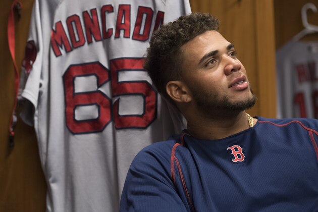 NEW YORK, NY - SEPTEMBER 28:  Yoan Moncada #65 of the Boston Red Sox sits at his locker before a game against the New York Yankees at Yankee Stadium on September 28, 2016 in the Bronx borough of New York City.  (Photo by Michael Ivins/Boston Red Sox/Getty Images)