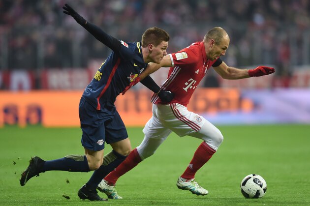 Leipzig's defender Marcel Halstenberg (L) and Bayern Munich's Dutch midfielder Arjen Robben (R) vie for the ball during the German first division Bundesliga football match FC Bayern Munich vs RB Leipzig in Munich, Germany, on December 21, 2016. / AFP / Christof STACHE / RESTRICTIONS: DURING MATCH TIME: DFL RULES TO LIMIT THE ONLINE USAGE TO 15 PICTURES PER MATCH AND FORBID IMAGE SEQUENCES TO SIMULATE VIDEO. == RESTRICTED TO EDITORIAL USE == FOR FURTHER QUERIES PLEASE CONTACT DFL DIRECTLY AT   49 69 650050        (Photo credit should read CHRISTOF STACHE/AFP/Getty Images)