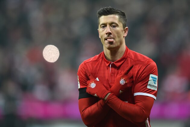 Bayern Munich's Polish striker Robert Lewandowski celebrates after the third goal for Munich during the German first division Bundesliga football match FC Bayern Munich vs RB Leipzig in Munich, Germany, on December 21, 2016. / AFP / Christof STACHE / RESTRICTIONS: DURING MATCH TIME: DFL RULES TO LIMIT THE ONLINE USAGE TO 15 PICTURES PER MATCH AND FORBID IMAGE SEQUENCES TO SIMULATE VIDEO. == RESTRICTED TO EDITORIAL USE == FOR FURTHER QUERIES PLEASE CONTACT DFL DIRECTLY AT + 49 69 650050
        (Photo credit should read CHRISTOF STACHE/AFP/Getty Images)