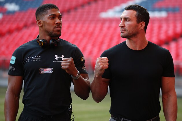 Britain's Anthony Joshua (L) poses with Ukraine's Wladimir Klitschko on the pitch at Wembley Stadium after giving a press conference in north west London on December 14, 2016.

Klitschko will fight Joshua on April 29, 2017 at Wembley Stadium in London / AFP / Daniel LEAL-OLIVAS        (Photo credit should read DANIEL LEAL-OLIVAS/AFP/Getty Images)