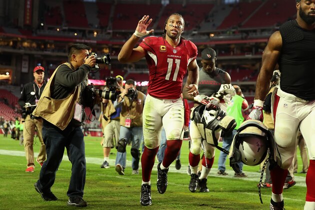 GLENDALE, AZ - DECEMBER 18:  Wide receiver Larry Fitzgerald #11 of the Arizona Cardinals waves to fans as he runs off the field folowing the NFL game against the New Orleans Saints at the University of Phoenix Stadium on December 18, 2016 in Glendale, Arizona. The Saints defeated the Cardinals 48-41.  (Photo by Christian Petersen/Getty Images)