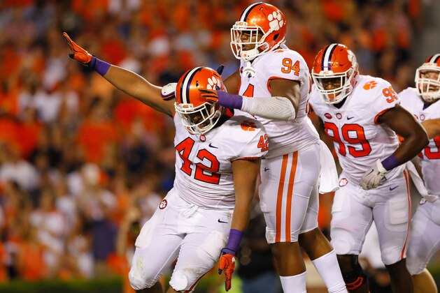 AUBURN, AL - SEPTEMBER 03:  Christian Wilkins #42 of the Clemson Tigers celebrates with teammates after sacking Jeremy Johnson #6 of the Auburn Tigers (not pictured) during the first half at Jordan Hare Stadium on September 3, 2016 in Auburn, Alabama.  (Photo by Kevin C. Cox/Getty Images)