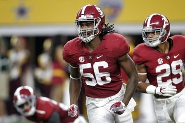 Alabama linebacker Tim Williams (56) and Minkah Fitzpatrick (29) jog off the field during an NCAA college football game against Southern California on Saturday, Sept. 3, 2016, in Arlington, Texas. (AP Photo/Roger Steinman)