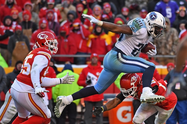 KANSAS CITY, MO - DECEMBER 18: Running back DeMarco Murray #29 of the Tennessee Titans leaps over a the Kansas City Chiefs defender during the second half on December 18, 2016 at Arrowhead Stadium in Kansas City, Missouri. (Photo by Peter Aiken/Getty Images)