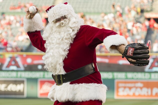 ANAHEIM, CA - JUNE 25: Santa Claus throws out a ceremonial first pitch as part of a 'Christmas in June' promotion before the game between the Oakland Athletics and the Los Angeles Angels of Anaheim at Angel Stadium of Anaheim on June 25, 2016 in Anaheim, California. (Photo by Matt Brown/Angels Baseball LP/Getty Images)