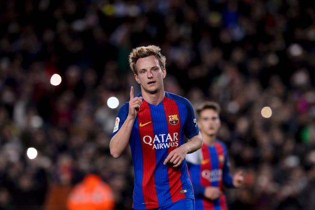 Barcelona's Croatian midfielder Ivan Rakitic celebrates after scoring during the Spanish Copa del Rey (King's Cup) round of 32 second leg football match FC Barcelona vs Hercules CF at the Camp Nou stadium in Barcelona on December 21, 2016. / AFP / JOSEP LAGO        (Photo credit should read JOSEP LAGO/AFP/Getty Images)