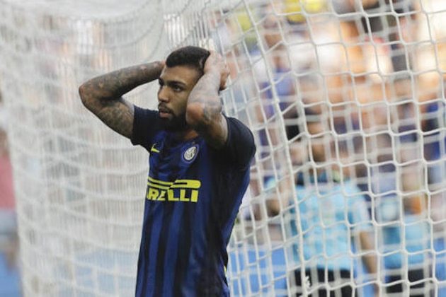 Inter Milan's Gabriel Barbosa holds his head after missing a scoring chance during a Serie A soccer match between Inter Milan and Bologna, at the San Siro stadium in Milan, Italy, Sunday, Sept. 25, 2016. The match ended in a 1-1 draw. (AP Photo/Luca Bruno)