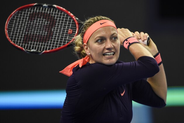 Petra Kvitova of the Czech Republic hits a return against Garbine Muguruza of Spain during the women's single third round of the China Open tennis tournament in Beijing on October 5, 2016. / AFP / FRED DUFOUR        (Photo credit should read FRED DUFOUR/AFP/Getty Images)
