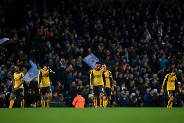 MANCHESTER, ENGLAND - DECEMBER 18: The Arsenal team are dejected after Manchester City score their second goal of the game during the Premier League match between Manchester City and Arsenal at the Etihad Stadium on December 18, 2016 in Manchester, England.  (Photo by Michael Regan/Getty Images)