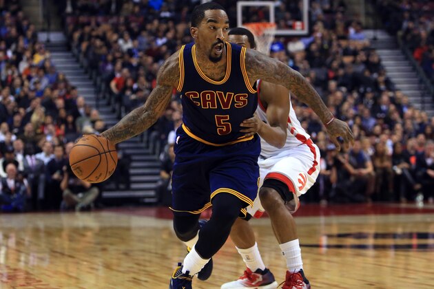 TORONTO, ON - DECEMBER 05:  J.R. Smith #5 of the Cleveland Cavaliers dribbles the ball as Kyle Lowry #7 of the Toronto Raptors defends during the first half of an NBA game at Air Canada Centre on December 5, 2016 in Toronto, Canada.  NOTE TO USER: User expressly acknowledges and agrees that, by downloading and or using this photograph, User is consenting to the terms and conditions of the Getty Images License Agreement.  (Photo by Vaughn Ridley/Getty Images)