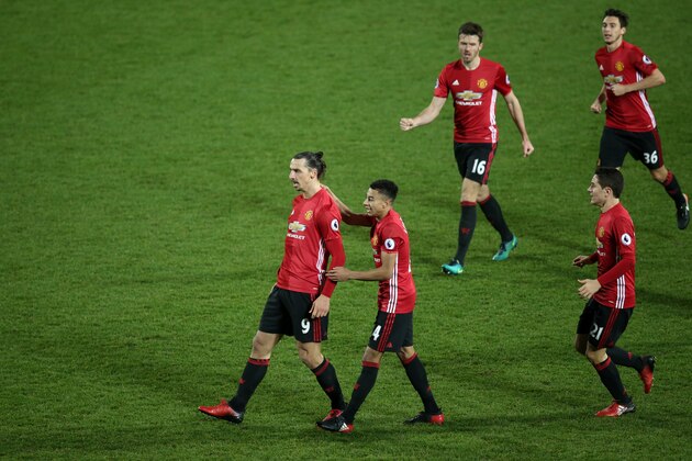 WEST BROMWICH, ENGLAND - DECEMBER 17:  Zlatan Ibrahimovic of Manchester United celebrates scoring the first goal with Jesse Lingard to make the score 0-2 during the Premier League match between West Bromwich Albion and Manchester United at The Hawthorns on December 17, 2016 in West Bromwich, England.  (Photo by Robbie Jay Barratt - AMA/Getty Images)