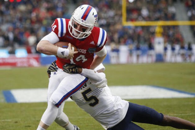 Louisiana Tech quarterback Ryan Higgins (14) carries the ball for a touchdown in front of Navy linebacker Justin Norton (5) during first half of the Armed Forces Bowl NCAA college football game, Friday, Dec. 23, 2016, in Fort Worth, Texas. (AP Photo/Jim Cowsert)