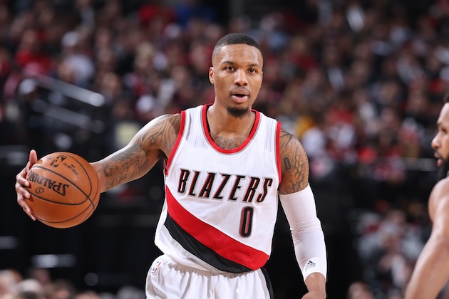 PORTLAND, OR - DECEMBER 23:  Damian Lillard #0 of the Portland Trail Blazers handles the ball against the San Antonio Spurs during the game on December 23, 2016 at the Moda Center in Portland, Oregon. NOTE TO USER: User expressly acknowledges and agrees that, by downloading and or using this Photograph, user is consenting to the terms and conditions of the Getty Images License Agreement. Mandatory Copyright Notice: Copyright 2016 NBAE (Photo by Sam Forencich/NBAE via Getty Images)