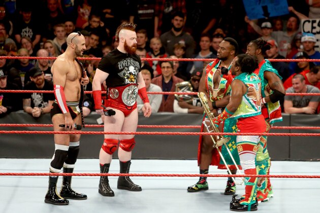 Cesaro and Sheamus wth their new tag titles.