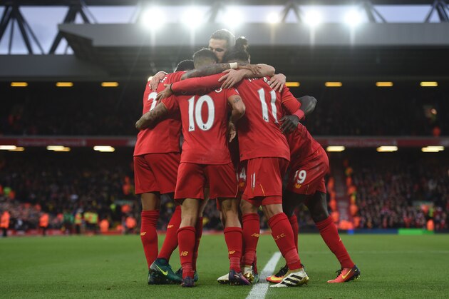 Liverpool's Senegalese midfielder Sadio Mane (R) celebrates scoring his team's fifth goal with Liverpool's Brazilian midfielder Philippe Coutinho (C) and Liverpool's Brazilian midfielder Roberto Firmino (2R) during the English Premier League football match between Liverpool and Watford at Anfield in Liverpool, north west England on November 6, 2016. / AFP / PAUL ELLIS / RESTRICTED TO EDITORIAL USE. No use with unauthorized audio, video, data, fixture lists, club/league logos or 'live' services. Online in-match use limited to 75 images, no video emulation. No use in betting, games or single club/league/player publications.  /         (Photo credit should read PAUL ELLIS/AFP/Getty Images)