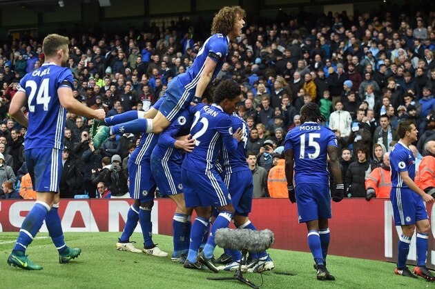 Chelsea's Belgian midfielder Eden Hazard celebrates scoring his team's third goal during the English Premier League football match between Manchester City and Chelsea at the Etihad Stadium in Manchester, north west England, on December 3, 2016. / AFP / Paul ELLIS / RESTRICTED TO EDITORIAL USE. No use with unauthorized audio, video, data, fixture lists, club/league logos or 'live' services. Online in-match use limited to 75 images, no video emulation. No use in betting, games or single club/league/player publications.  /         (Photo credit should read PAUL ELLIS/AFP/Getty Images)