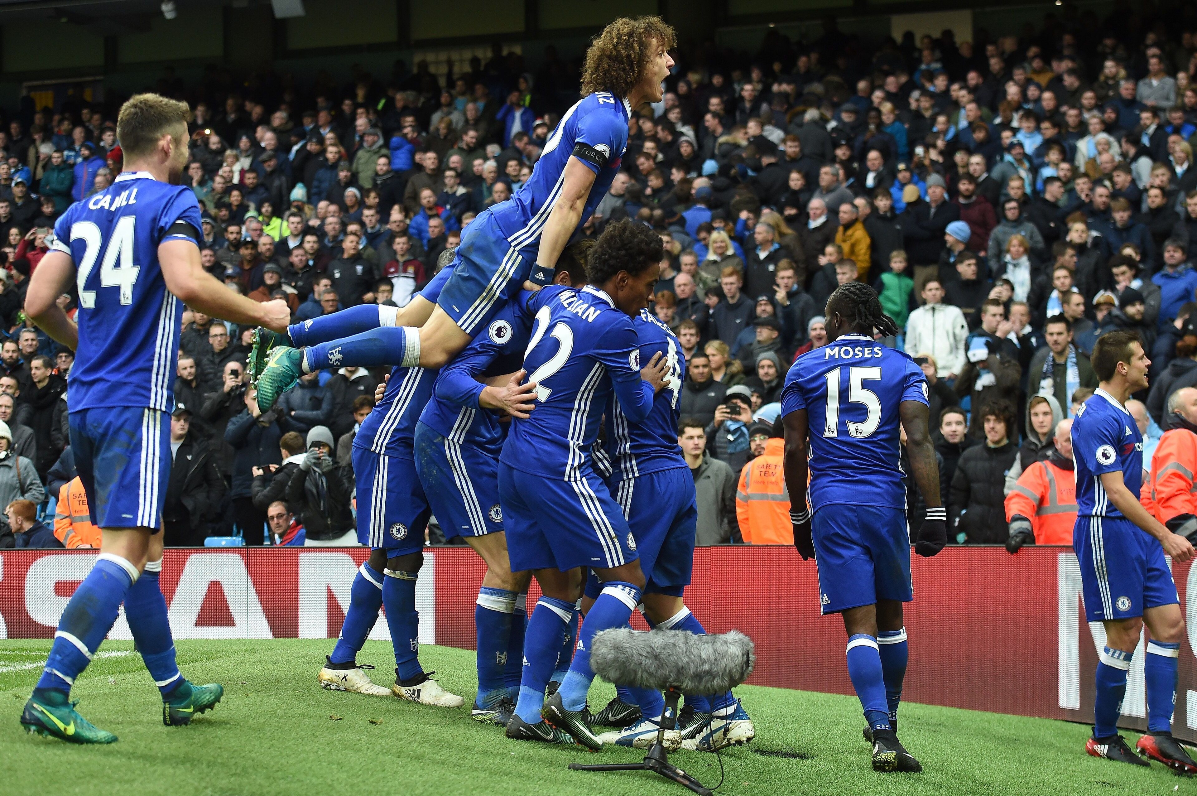 Chelsea's Belgian midfielder Eden Hazard celebrates scoring his team's third goal during the English Premier League football match between Manchester City and Chelsea at the Etihad Stadium in Manchester, north west England, on December 3, 2016. / AFP / Paul ELLIS / RESTRICTED TO EDITORIAL USE. No use with unauthorized audio, video, data, fixture lists, club/league logos or 'live' services. Online in-match use limited to 75 images, no video emulation. No use in betting, games or single club/league/player publications.  /         (Photo credit should read PAUL ELLIS/AFP/Getty Images)