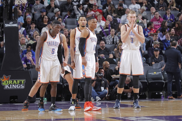 SACRAMENTO, CA - NOVEMBER 23: Victor Oladipo #5, Andre Roberson #21, Russell Westbrook #0 and Domantas Sabonis #3 of the Oklahoma City Thunder look on during the game against the Sacramento Kings on November 23, 2016 at Golden 1 Center in Sacramento, California. NOTE TO USER: User expressly acknowledges and agrees that, by downloading and or using this photograph, User is consenting to the terms and conditions of the Getty Images Agreement. Mandatory Copyright Notice: Copyright 2016 NBAE (Photo by Rocky Widner/NBAE via Getty Images)