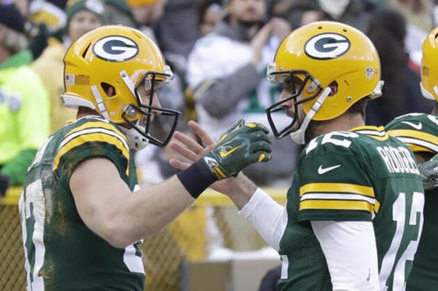 Green Bay Packers' Jordy Nelson celebrates his touchdown catch with Aaron Rodgers during the first half of an NFL football game against the Minnesota Vikings Saturday, Dec. 24, 2016, in Green Bay, Wis. (AP Photo/Morry Gash)