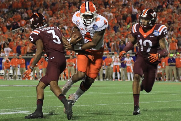 ORLANDO, FL - DECEMBER 03:  Deshaun Watson #4 of the Clemson Tigers scores a touchdown the ACC Championship against the Virginia Tech Hokies on December 3, 2016 in Orlando, Florida.  (Photo by Mike Ehrmann/Getty Images)