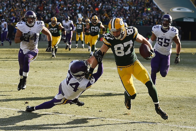 GREEN BAY, WI - DECEMBER 24:  Jordy Nelson #87 of the Green Bay Packers breaks a tackle by Andrew Sendejo #34 of the Minnesota Vikings during the second quarter of a game at Lambeau Field on December 24, 2016 in Green Bay, Wisconsin.  (Photo by Stacy Revere/Getty Images)