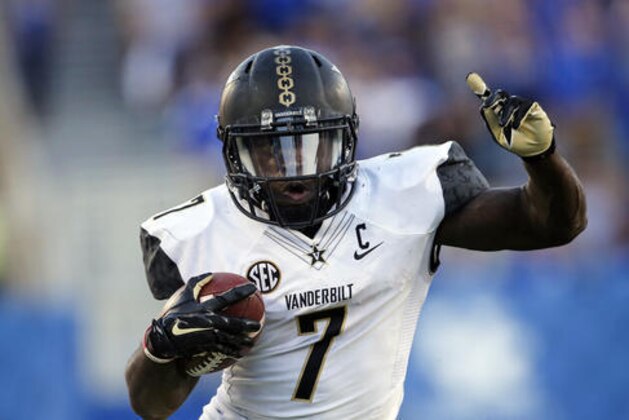 FILE - In this Oct. 8, 2016, file photo, Vanderbilt running back Ralph Webb runs the ball in the second half of an NCAA college football game against Kentucky, in Lexington, Ky. No. 24 Tennessee plays at Vanderbilt on Saturday night. (AP Photo/David Stephenson, File)