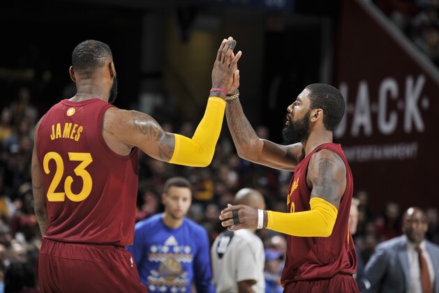 CLEVELAND, OH - DECEMBER 25:  Kyrie Irving #2 and LeBron James #23 of the Cleveland Cavaliers shake hands during the game against the Golden State Warriors on December 25, 2016 at Quicken Loans Arena in Cleveland, Ohio. NOTE TO USER: User expressly acknowledges and agrees that, by downloading and/or using this Photograph, user is consenting to the terms and conditions of the Getty Images License Agreement. Mandatory Copyright Notice: Copyright 2016 NBAE  (Photo by David Liam Kyle/NBAE via Getty Images)