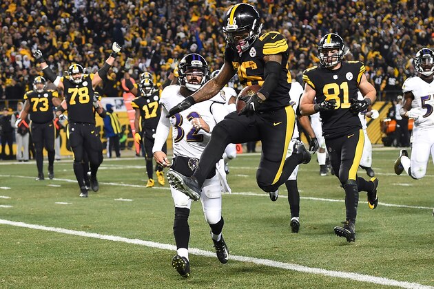 PITTSBURGH, PA - DECEMBER 25:  Le'Veon Bell #26 of the Pittsburgh Steelers leaps into the end zone in front of Eric Weddle #32 of the Baltimore Ravens for a 7 yard rushing touchdown in the fourth quarter during the game at Heinz Field on December 25, 2016 in Pittsburgh, Pennsylvania. (Photo by Joe Sargent/Getty Images)