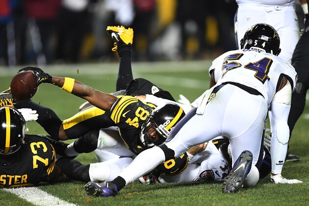 PITTSBURGH, PA - DECEMBER 25:  Antonio Brown #84 of the Pittsburgh Steelers reaches for the end zone to score a 4 yard touchdown in the fourth quarter during the game against the Baltimore Ravens at Heinz Field on December 25, 2016 in Pittsburgh, Pennsylvania. (Photo by Joe Sargent/Getty Images)